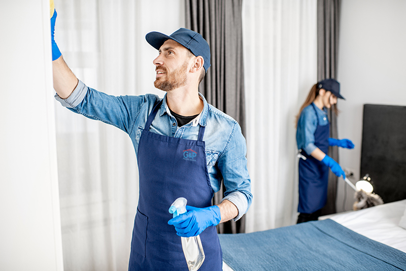 Professional cleaners during the work indoors